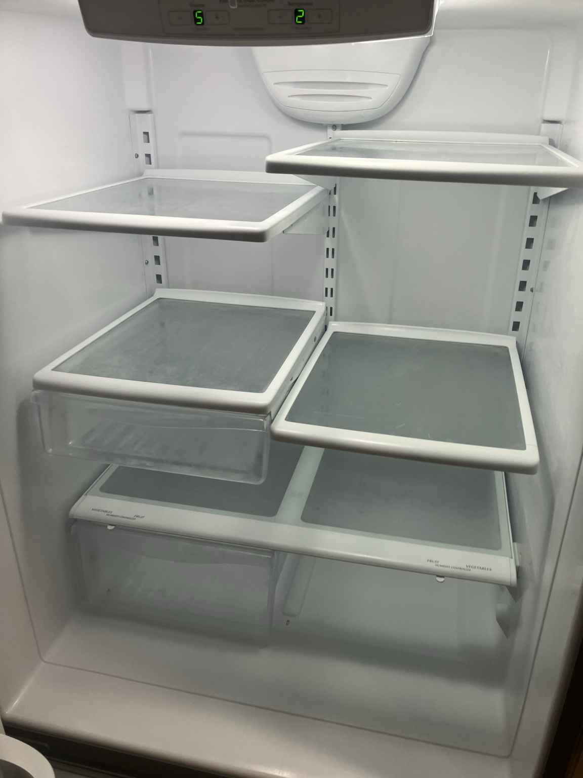 Refrigerator interior that appears clean from a normal viewing distance